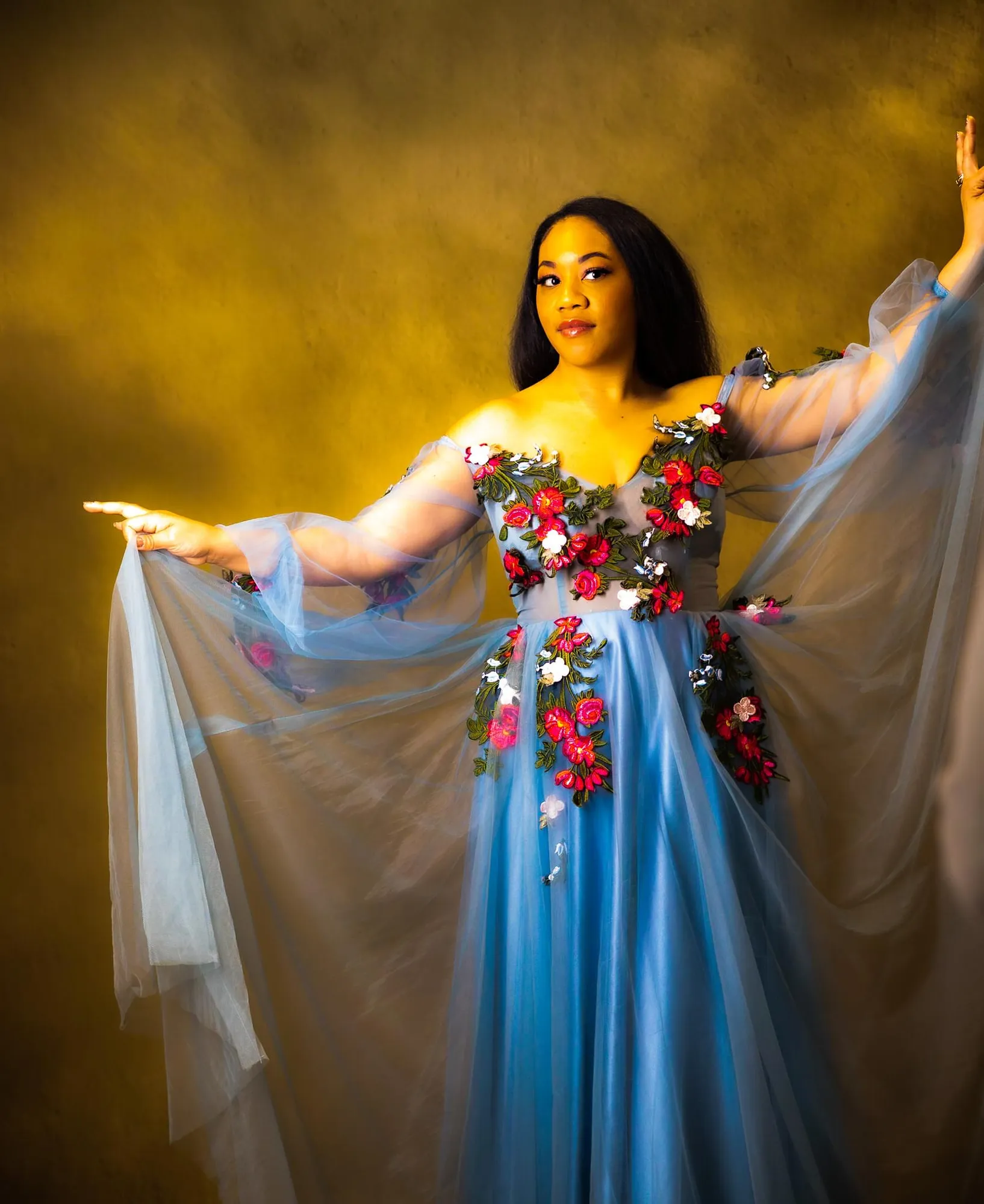 Fashion portrait in blue tulle gown